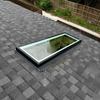 Solatube Premium Fixed Skylight with black frame installed on asphalt shingle roof.