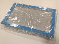 Exterior louver with blue frame and horizontal slats, packaged in clear plastic.
