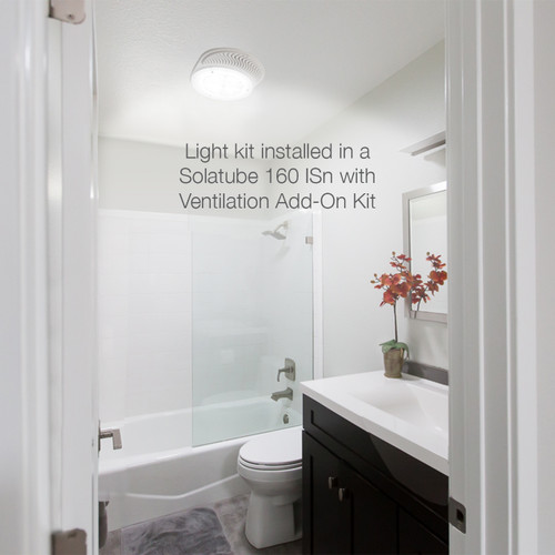 Solatube Light Add-On Kit installed in a bathroom, showing the diffuser with integrated lighting. Solatube Light Add-On Kit installed in a bathroom, showing the diffuser with integrated lighting.