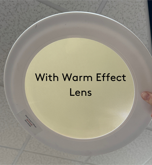 Round Solatube diffuser with a warm-toned lens.
