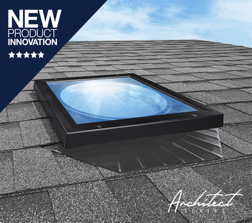 Solatube low-profile skylight on a shingled roof, reflecting blue sky. Solatube low-profile skylight on a shingled roof, reflecting blue sky.