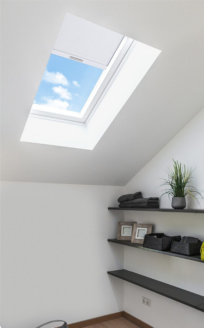 Solatube Premium Fixed Skylight with partially drawn shade, showing blue sky.
