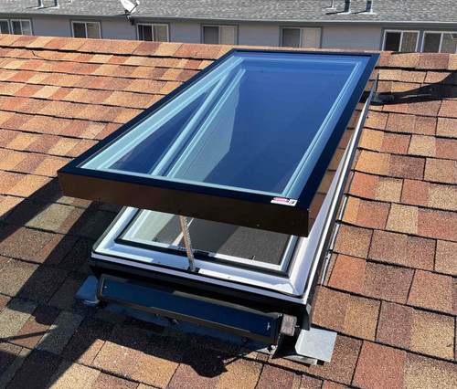 Solatube Solar-Powered Fresh Breeze Skylight, open on shingled roof.
