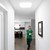 Square JustFrost fixture providing light in a hallway.