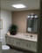 Solatube JustFrost Fixture installed in bathroom ceiling providing daylight.