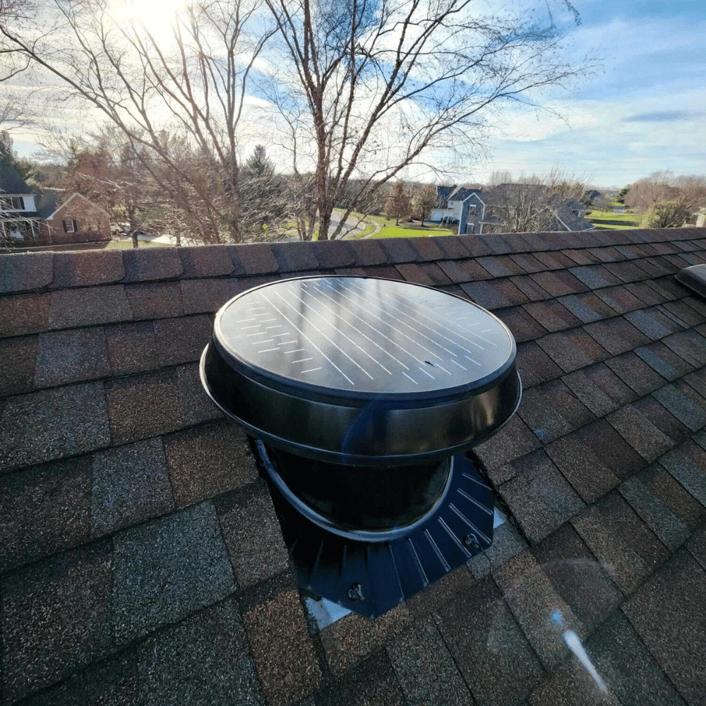 Solatube solar attic fan installed on a pitched roof