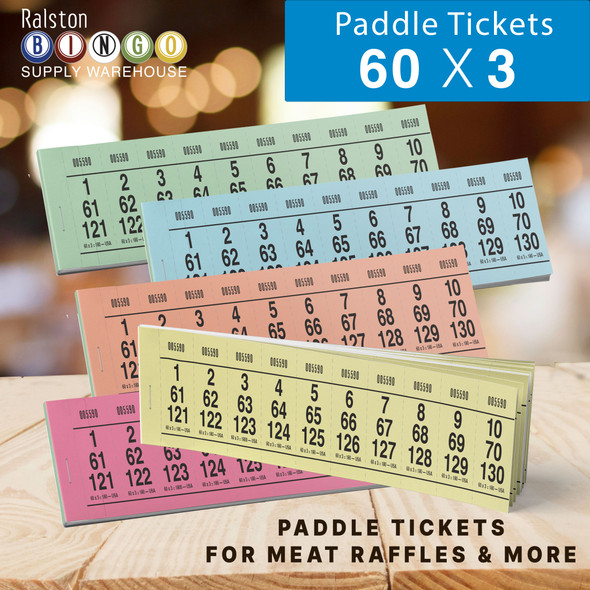Image of 60 - 2 paddle tickets from bingo supply warehouse displayed paddles in pink blue yellow orange and green with a soft lighted casino room in background