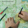 Semi circular map marking protractor held in hands