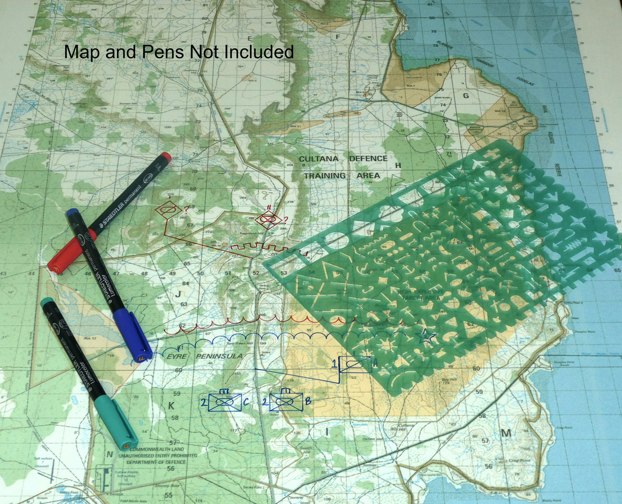Warfighting symbology stencil in use on a military map