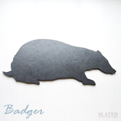 Natural slate cut in the shape of a badger. Made in Scotland and hand finished with soft red felt for use as a table mat, cheese board, black board or simply to decorate the home.
A great gift idea for badger lovers. Made in Scotland. worldwide delivery available.