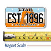 Utah License Plate Magnet displayed with a measuring tape for size reference.