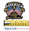USA crossed flags magnet beside a ruler for scale, measuring 3.3 inches wide by 2.8 inches tall.