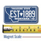 Montana License Plate Magnet displayed with a measuring tape for size reference.