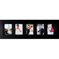 Modern wooden collage picture frame displayed on a living room wall featuring five 4x6 family photos