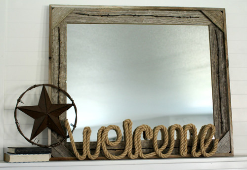 Rustic barnwood mirror with barbed wire frame and corner block design, western farmhouse wall décor