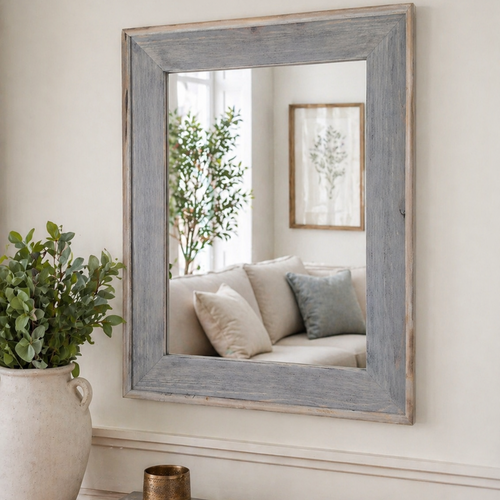 Rustic farmhouse wall mirror styled above console table with neutral decor