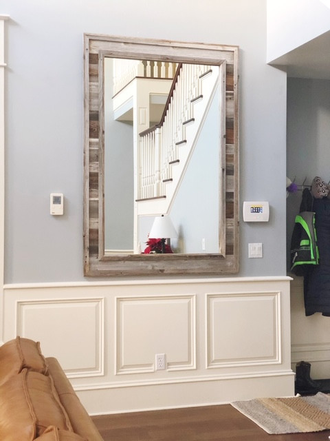 Rustic farmhouse wall mirror with authentic reclaimed wood grain and texture