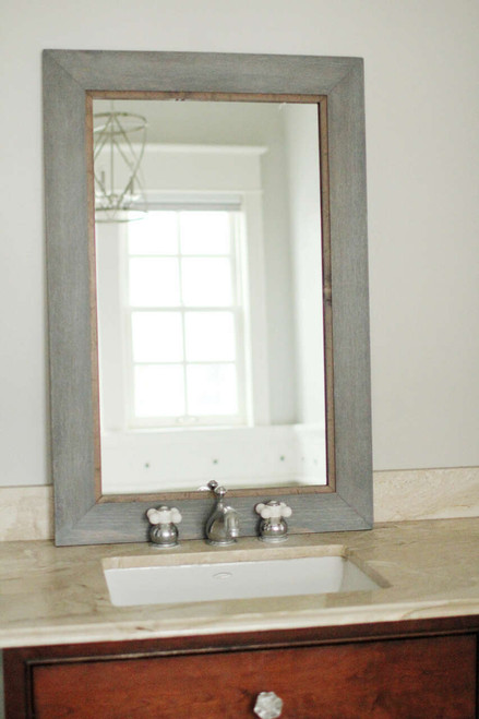 Colorado rustic mirror featuring a distressed grey cedar frame with a warm alder wood inset—creating a bold, layered look that adds depth and character to any space.