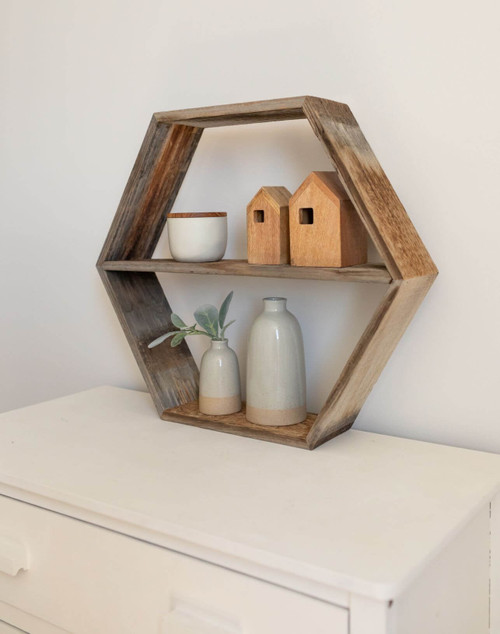 Unique hexagon shape with dual shelving levels creates a functional and eye-catching display for plants, décor, or keepsakes.