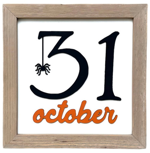 Handmade farmhouse Halloween wall sign featuring "31 October" lettering in a neutral wood frame for rustic fall home décor.