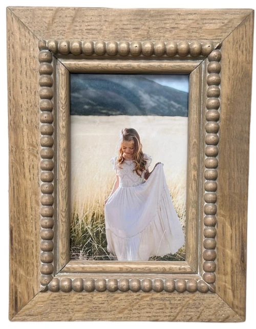 Modern white oak picture frame featuring clean lines and a natural wood finish, designed to beautifully showcase photos, artwork, or prints in any space.