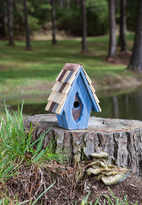 Handmade vintage blue birdhouse crafted for wrens with rustic farmhouse charm and wood texture