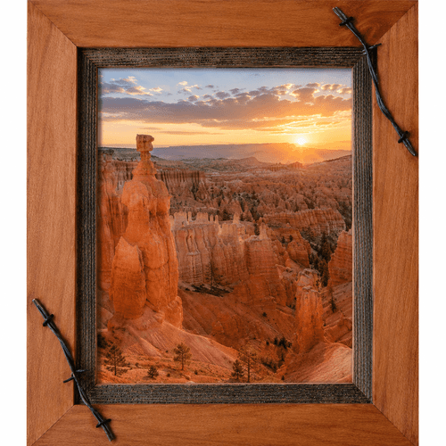 Rustic western picture frame handcrafted from solid wood and accented with authentic barbed wire corners. This 5x7 wood frame features warm natural tones, rugged ranch-inspired character, and a handcrafted design perfect for western art, wildlife photography, cabin décor, and rustic home interiors.