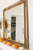 Farmhouse wall mirror made from reclaimed barnwood with warm alder trim and decorative barbed wire details.