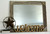 Rustic barnwood mirror with barbed wire frame and corner block design, western farmhouse wall décor