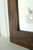 Distressed wood mirror frame in dark walnut stain with glaze, rustic farmhouse barnwood style