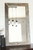 Reclaimed wood farmhouse mirror with simple flat frame and natural weathered barnwood texture