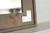 Handmade industrial farmhouse mirror with warm wood tones and metal corner hardware accents
