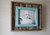 Handmade barnwood photo frame with rustic wood texture and vibrant painted slat accents
