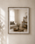 Distressed white framed mirror with clean minimalist design displayed above a wooden console table