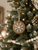 Handcrafted holiday ornament with rustic wood detail and timeless winter appeal