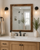 Handcrafted custom wood bathroom mirror with reclaimed barnwood frame in modern farmhouse bathroom