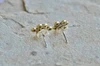 Eternity Knot Yellow Bronze Stud Earrings