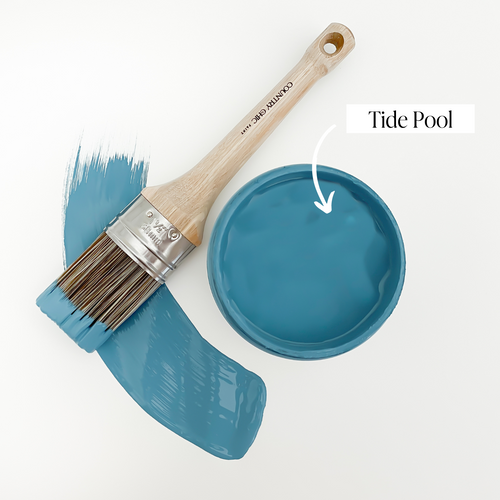 Top view of an open 16oz jar of Country Chic Chalk Style All-In-One Paint in the color Tide Pool. Tealish-ocean blue.