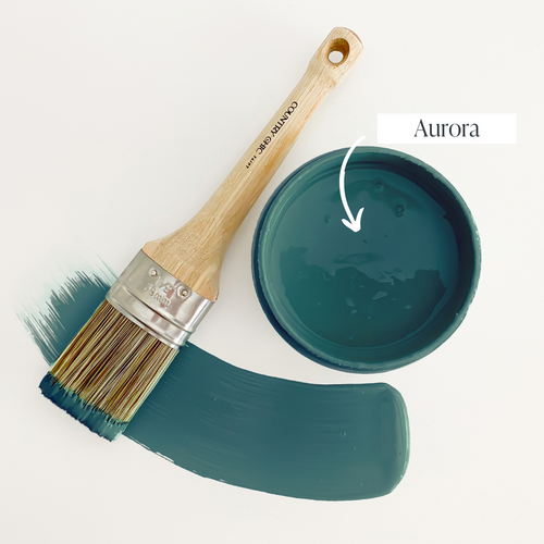Top view of an open 16oz jar of Country Chic Chalk Style All-In-One Paint in the color Aurora. Deep teal blue.