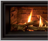 slim line surround on a fireplace with fire burning