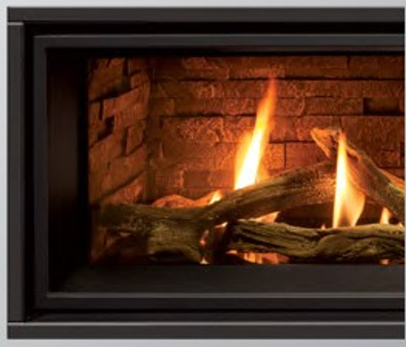 slim line surround on a fireplace with fire burning