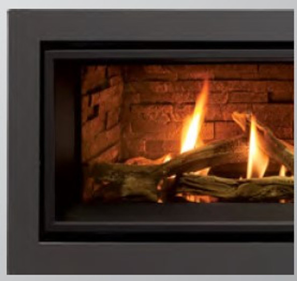 grey surround on fireplace that is burning