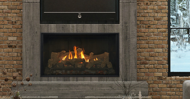 Bellingham fireplace with traditional log set, glass firebox panels. A TV is installed above it.