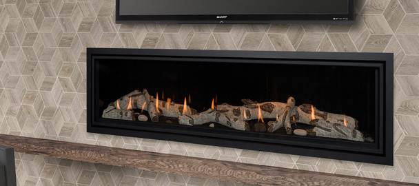 Callaway linear fireplace with birch Log Set and black glass interior panels. A TV is installed above.