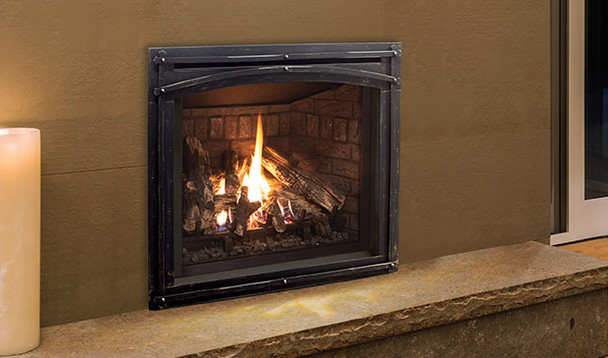 Q2 gas fireplace with traditional log set burning ,  ceramic brick liner, Forgeworks Face