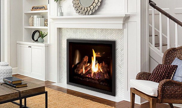 Q3 gas fireplace with black enameled liner and log set burning in a living room