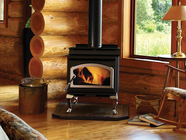 Performer S210 wood stove burning in living room of a log cabin