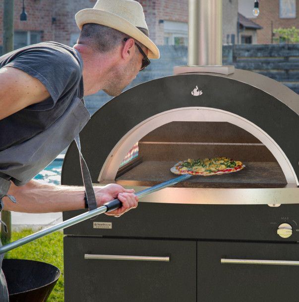 cooking a pizza Genio Pizza Oven