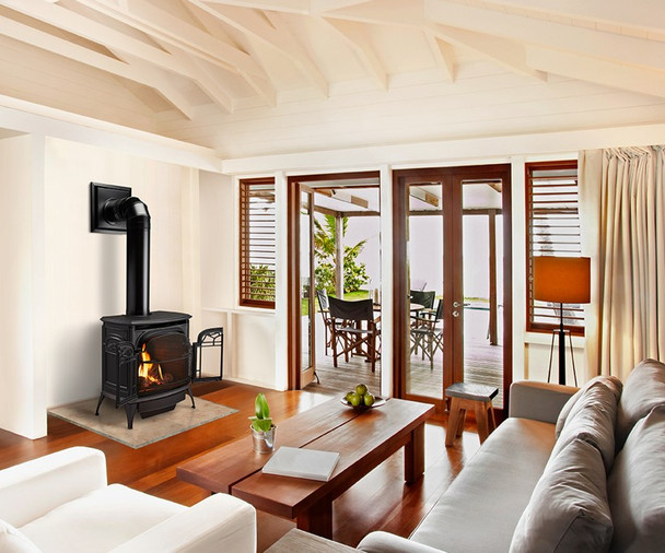 Classic black Stardance direct vent gas stove in a living room.