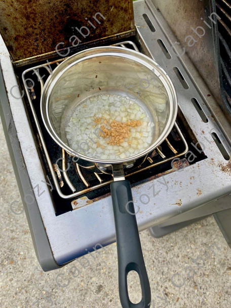 onions and garlic cooking in pot